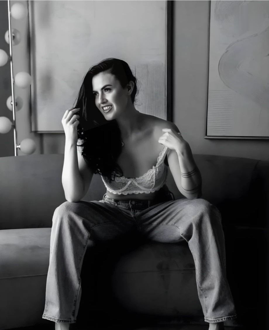 Black and white editorial of Tzarina on a sofa